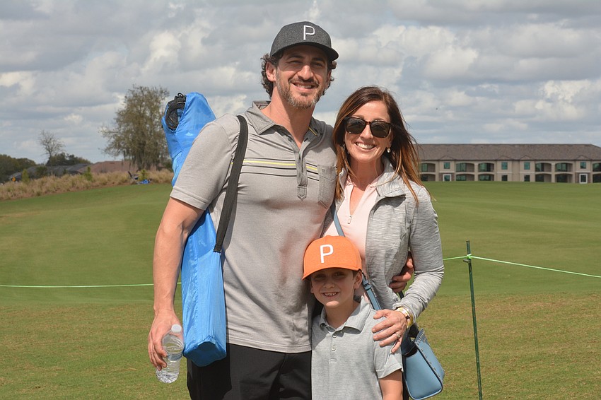 Ronnie, Jenn and Dylanger Appel received a ball from golfer Ben Kohles shortly after arriving on Sunday.