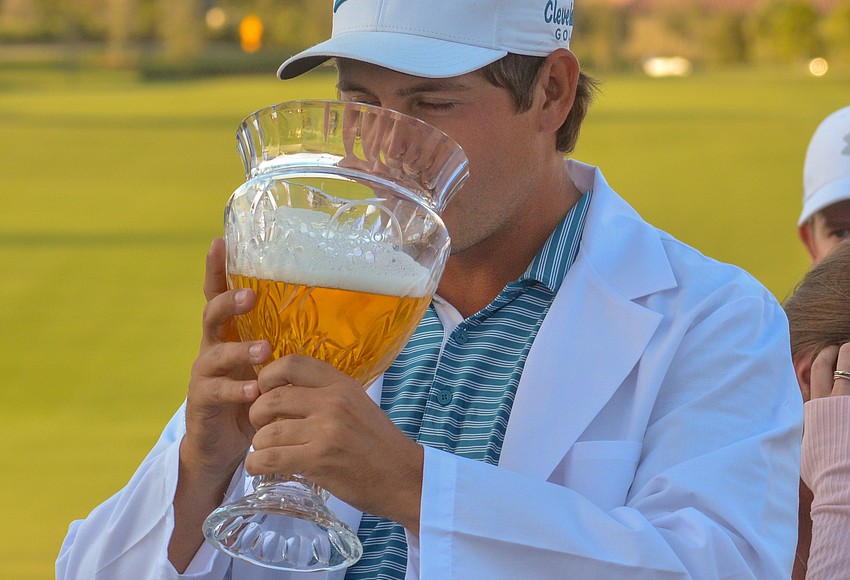 your-observer-photo-andrew-novak-drinks-a-celebratory-beer-out-of