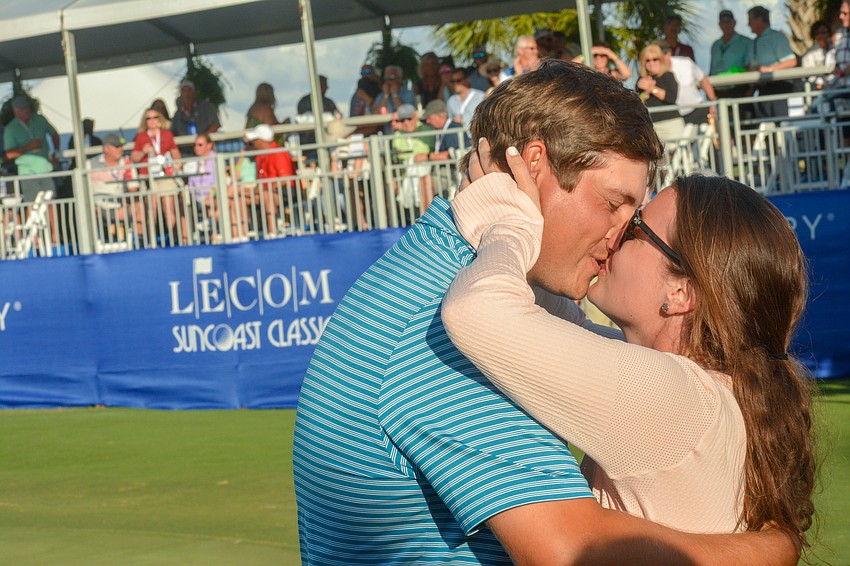 Andrew Novak kisses his girlfriend, Maddie Myers, after winning the 2020 LECOM Suncoast Classic.