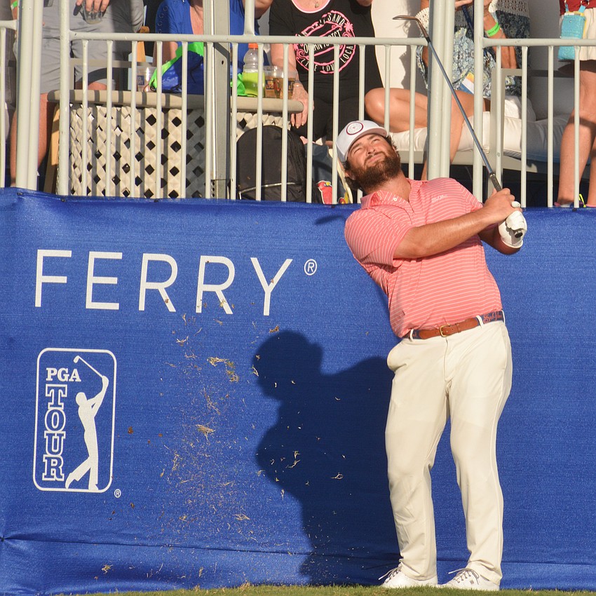 Greyson Sigg chips onto the green in front of the grandstand on the 18th hole. Sigg's second shot landed in the grandstand.