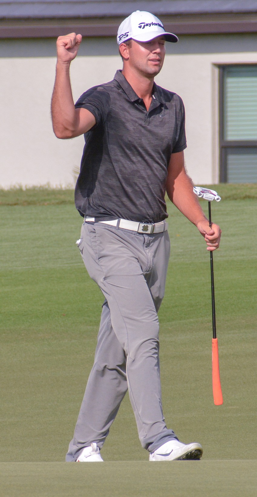 Taylor Montgomery pumps his first after a birdie on 17 to take the lead. Montgomery would finish third (21 under par).