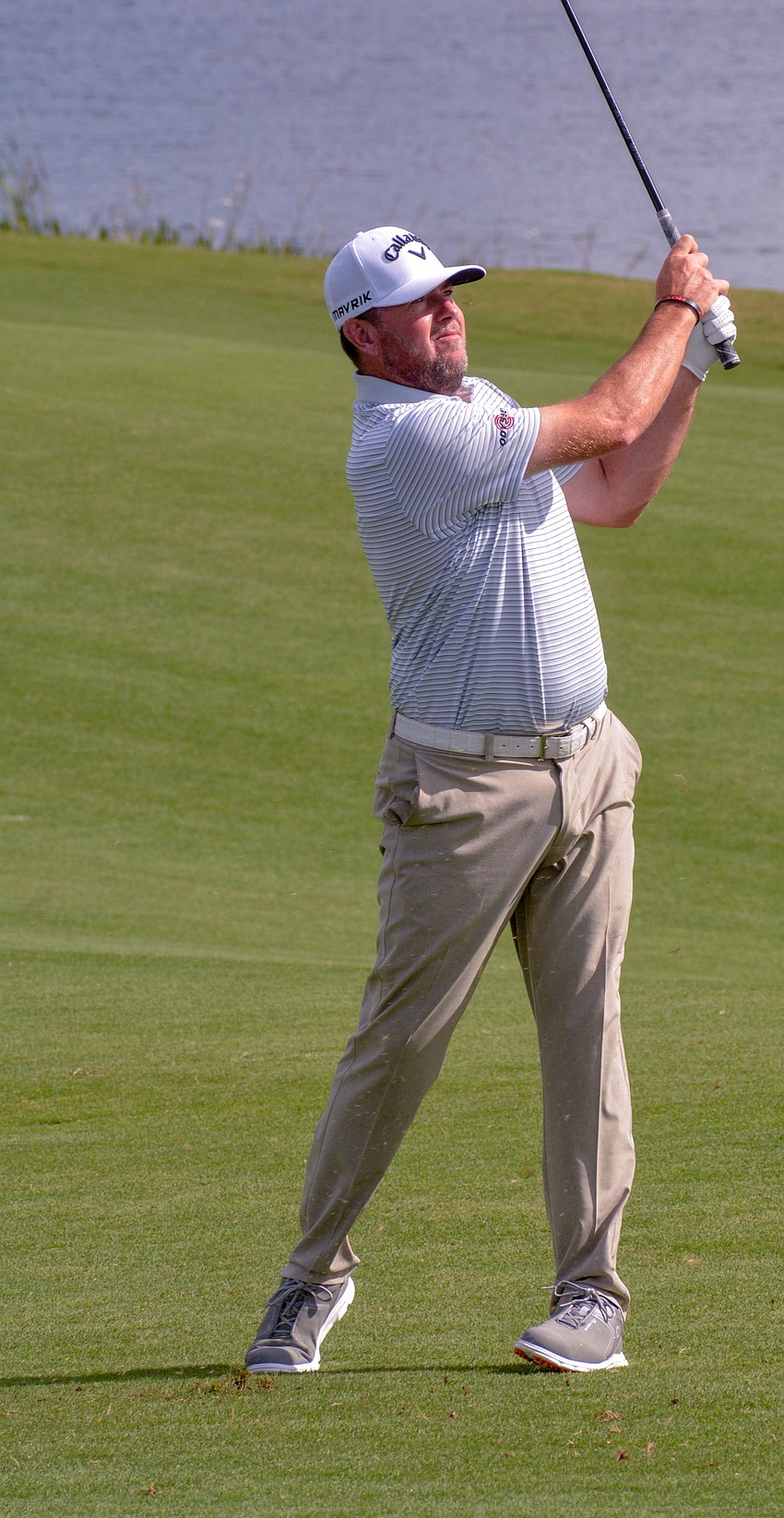 Robert Garrigus hits his second shot on the 11th hole. Garrigus finished 18 under par.