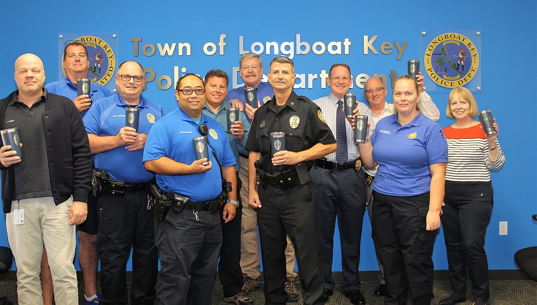 Members of the Longboat Key Police Department with their gifts.