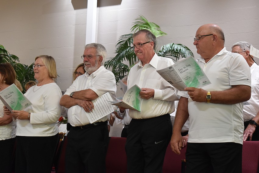 Choir members keep track of the original songs Choplin composed.