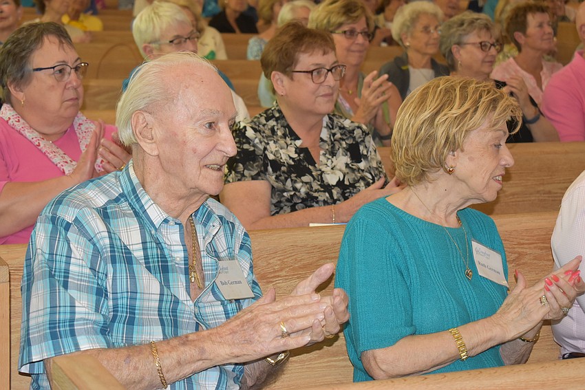 Bob and Ruth German in the front row clap during the concert.