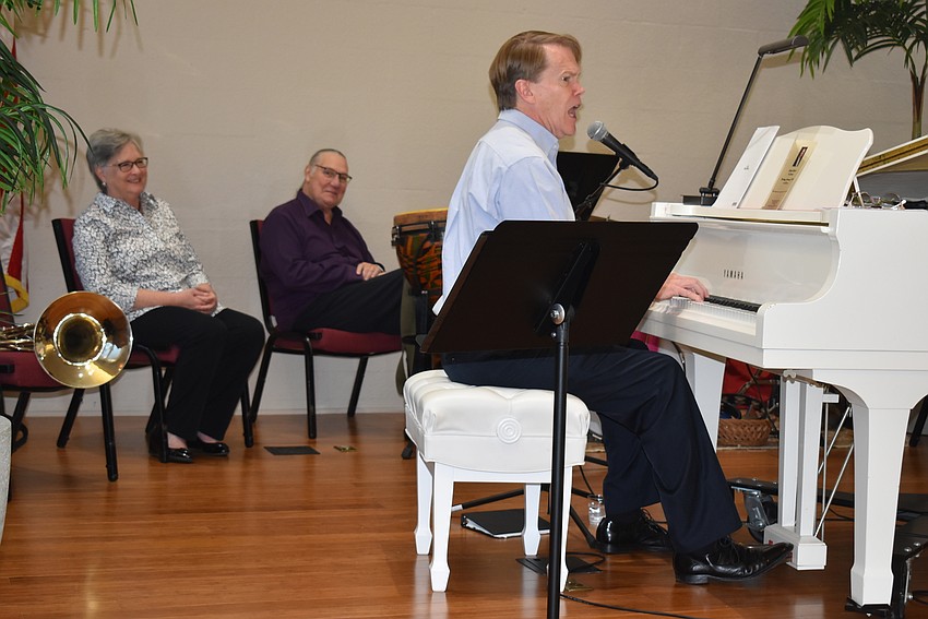 Choplin muses at his piano.