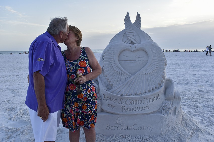 Chip and Pat Mack share a kiss before the ceremony.