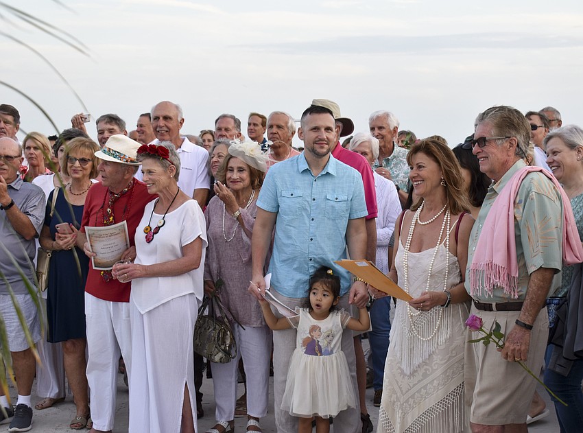 The couples wait for the ceremony to begin.