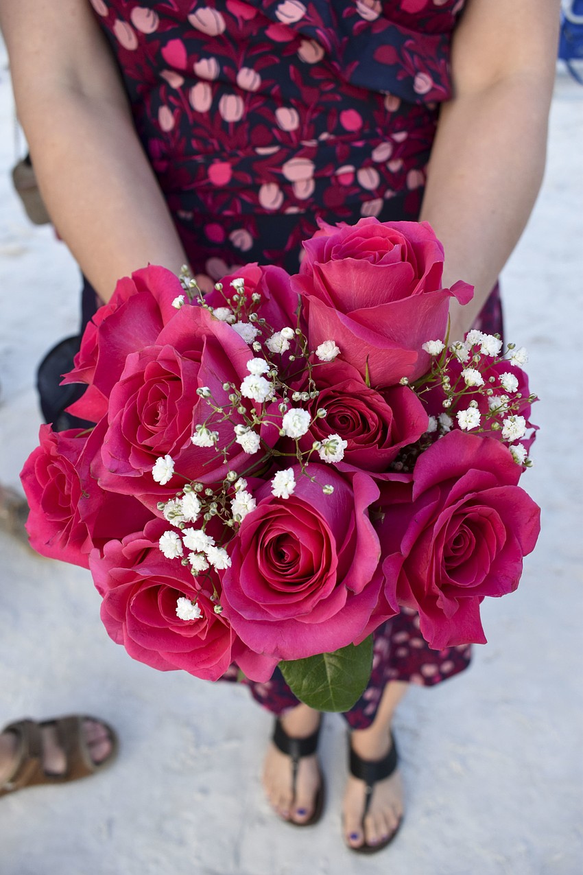 Julie Emrick brought a fuschia bouquet to the ceremony.
