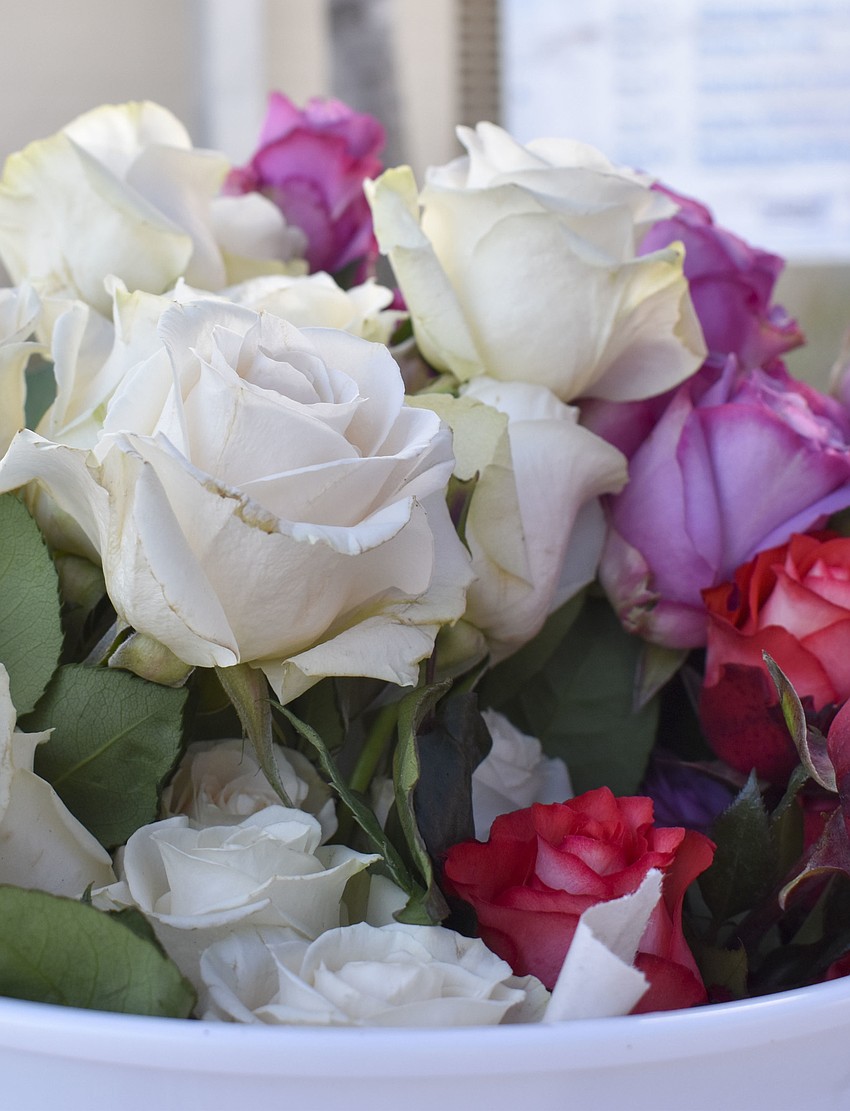 Roses were passed out to each of the couple.