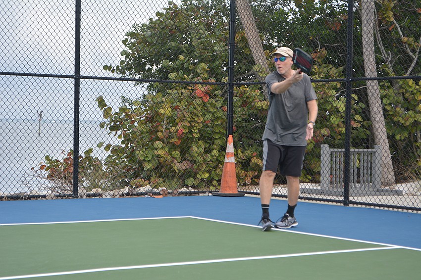 Ken Drost follows through after hitting the ball.