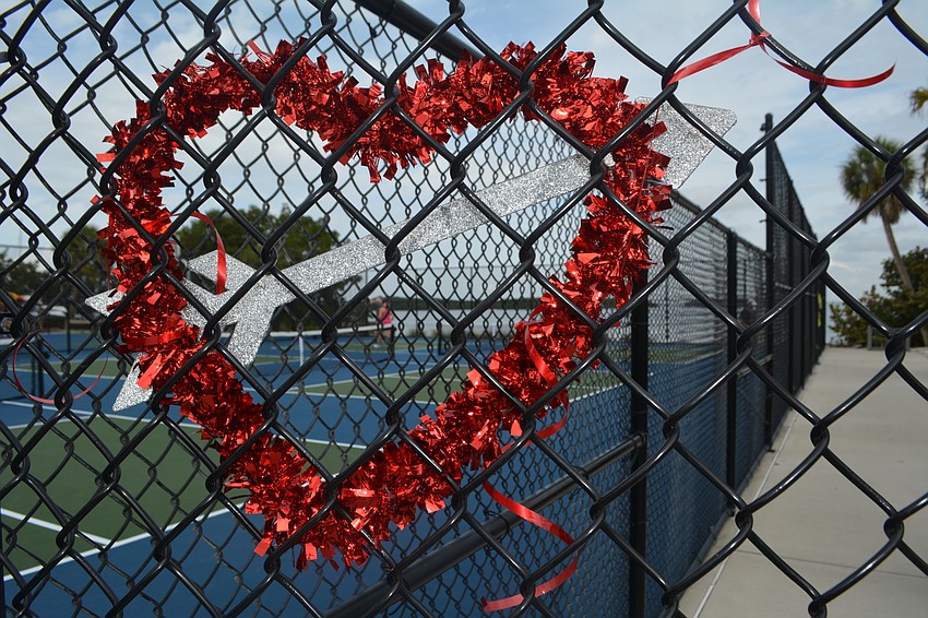 One final pickleball game continues at the end of the Beauty and the Beast tournament Friday.