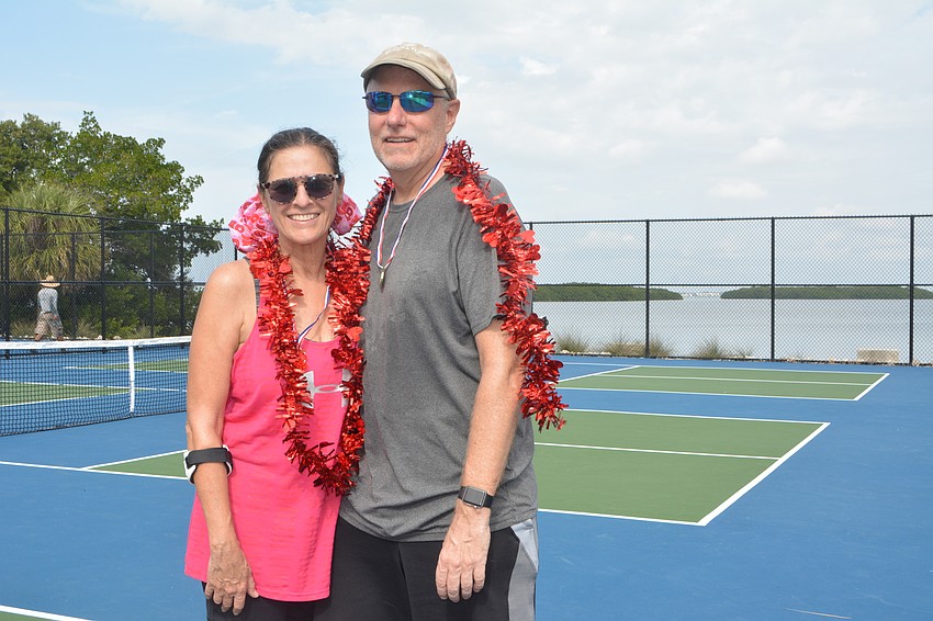 Dawn (left) and Ken Drost pose after competing in the Beauty and the Beast tournament Friday.