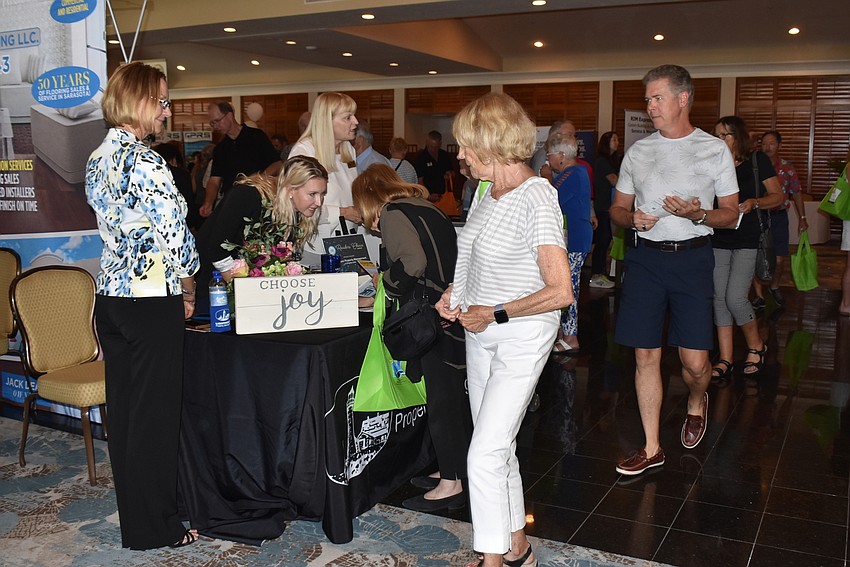 Attendees make their way around the booths.