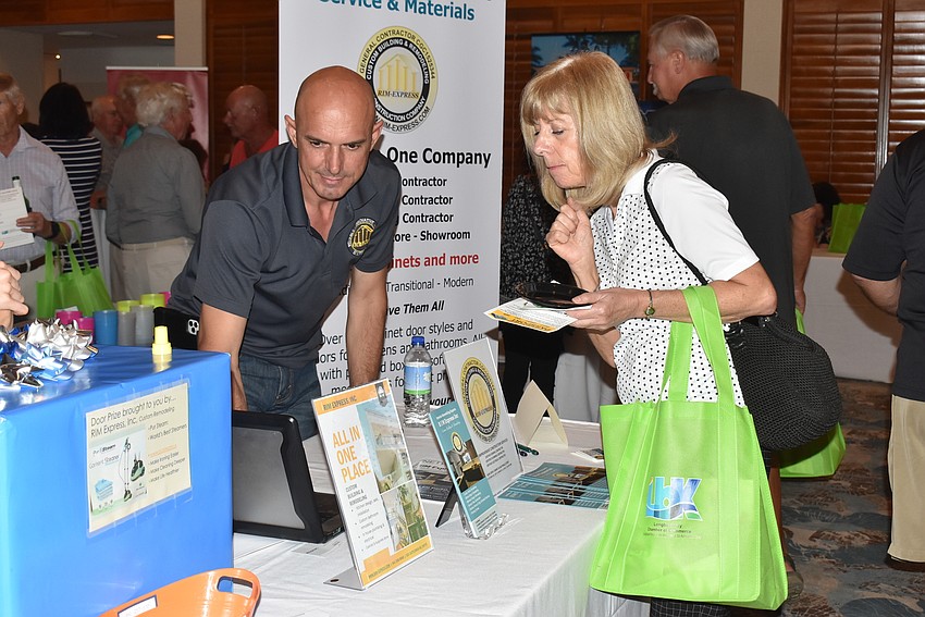 Ivan Radosavljevic shows Karen Macintosh RIM Express' services.