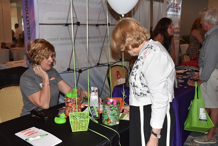 Dana Scott shows Servpro services to Michaele McKenna.
