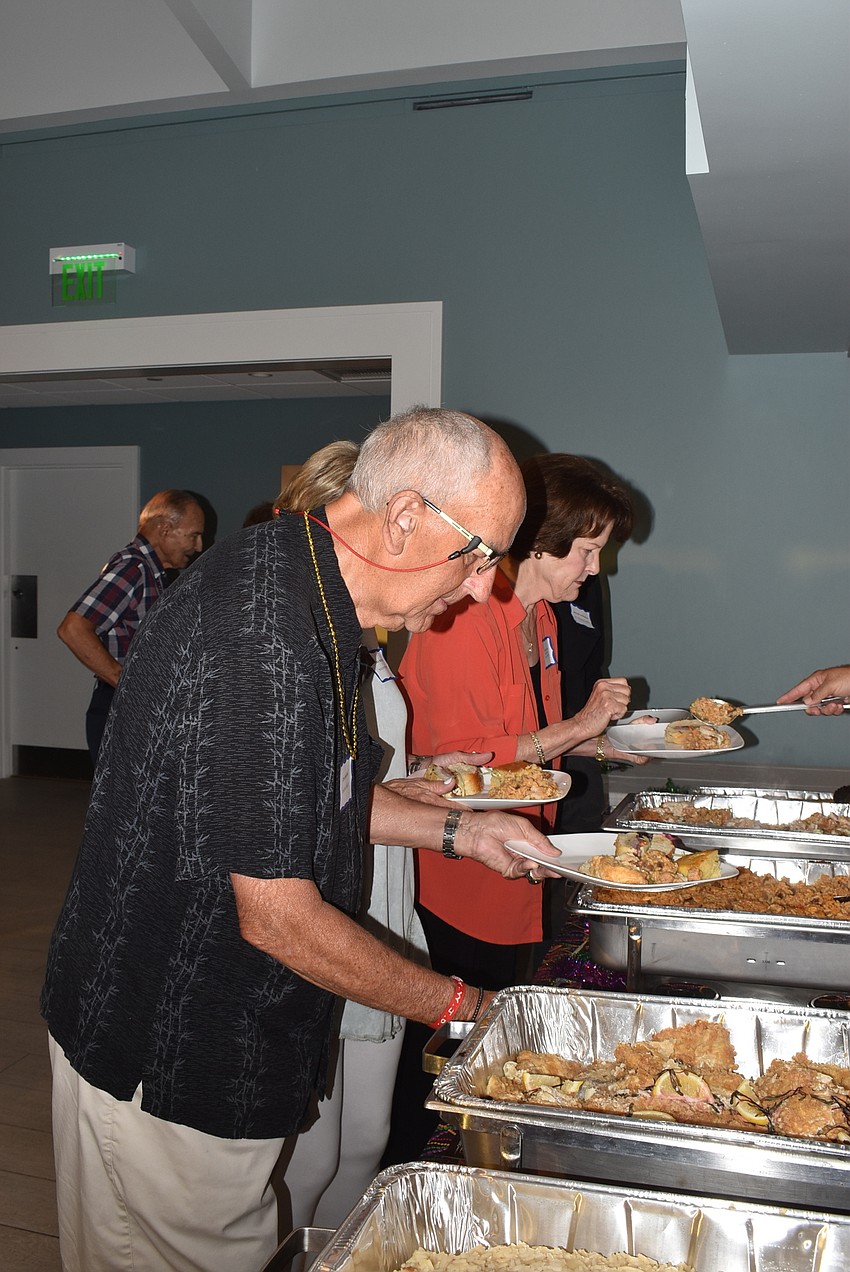 Jim Brown serves up his dinner.