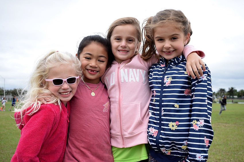 First graders Charlotte Miiller, Isabella Jaimes, Lauren Bittar and Eyla Yildirim love jumping over obstacles.