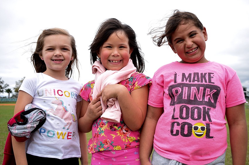 First graders Kailynn Moore, Aliana Olavarria Gines and Phoebe Kersting are best friends. They walked together during the walkathon.
