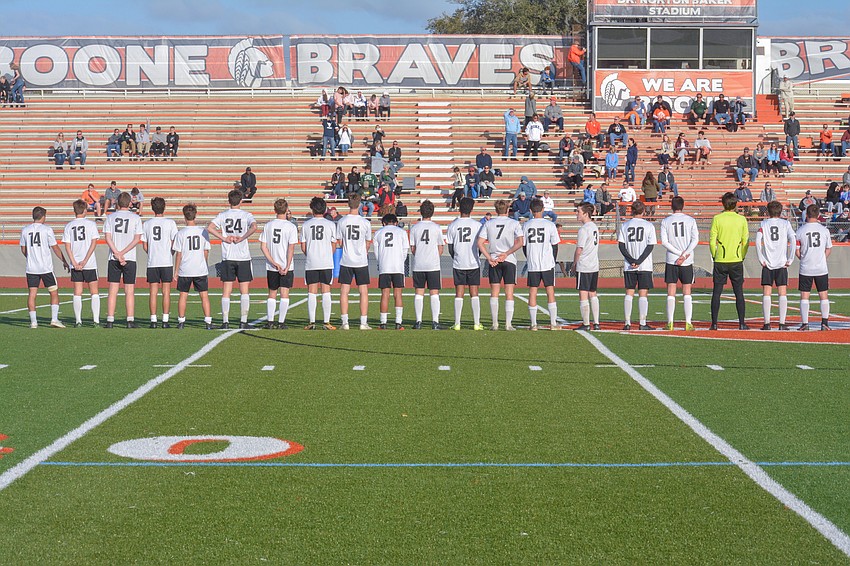 The Mustangs stand for the player introductions.