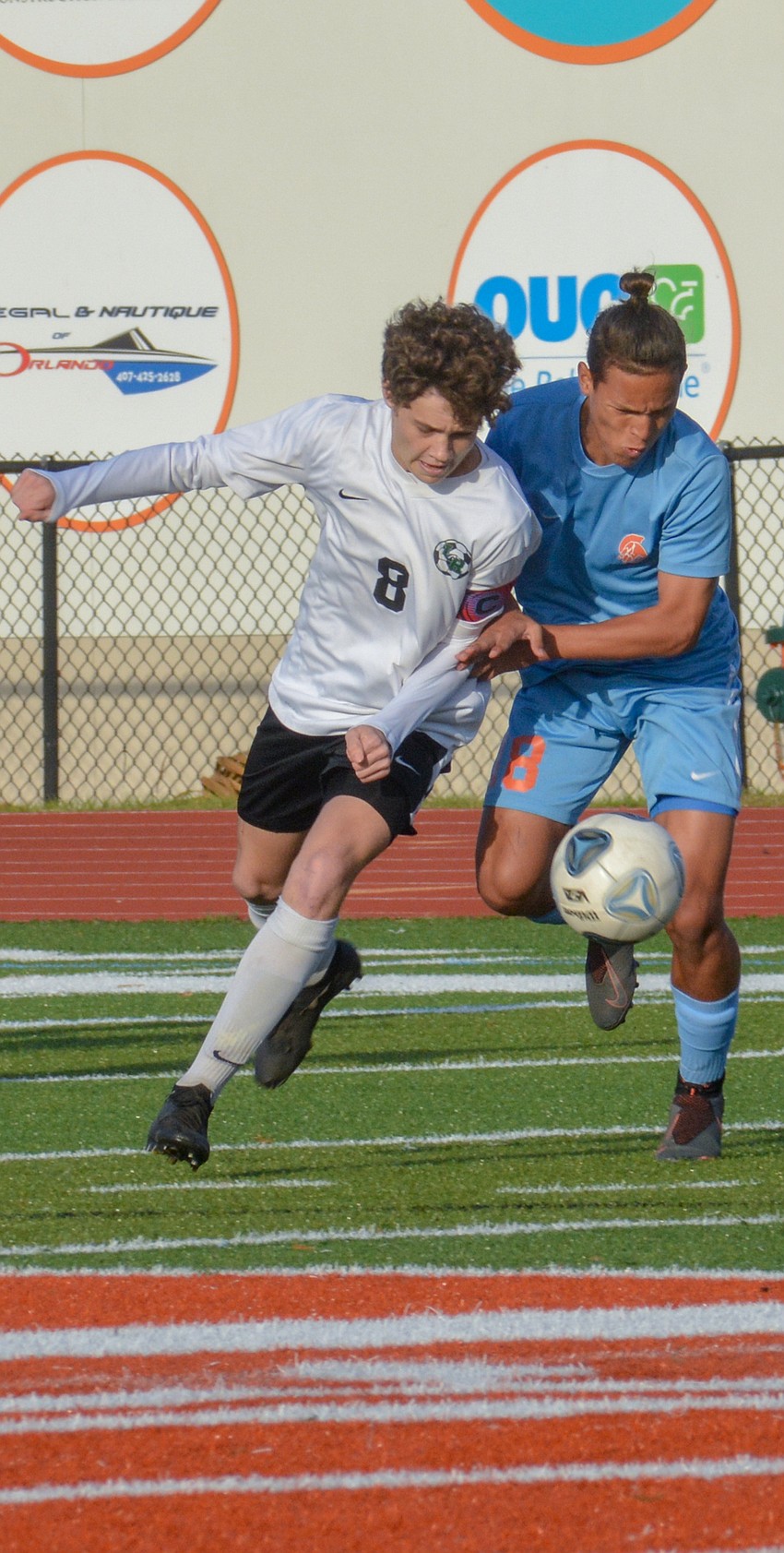 Mustangs senior Jacob Jordan (8) gets past Boone's Alejandro Duarte.