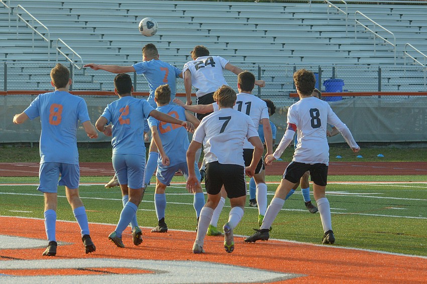 The Mustangs, including sophomore Drew Clark (24), react to a corner kick. Clark would later score the team's lone goal.