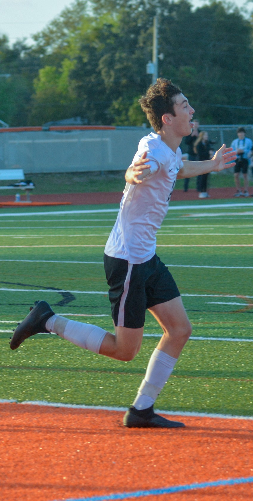 Drew Clark celebrates after scoring a goal for the Mustangs.