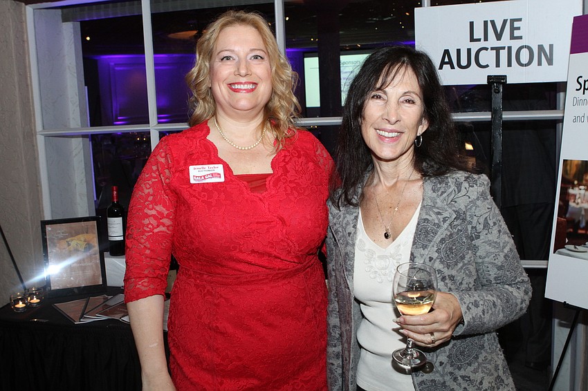 Auctioneer Jenelle Taylor and Debbie Shorey