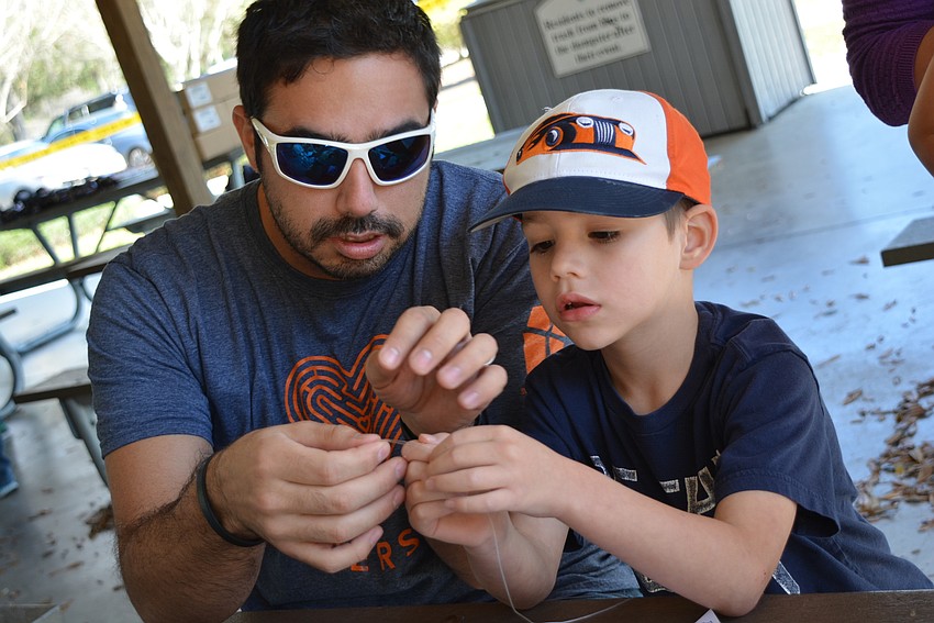 Sammy and Shane Duran, of Parrish, practice the uni knot.