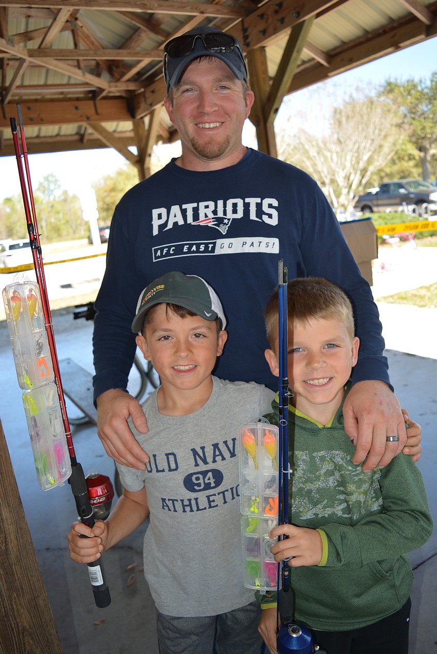 Gavin, Steve and Callan Hackett were excited to learn more about fishing — especially about how to tie knots.