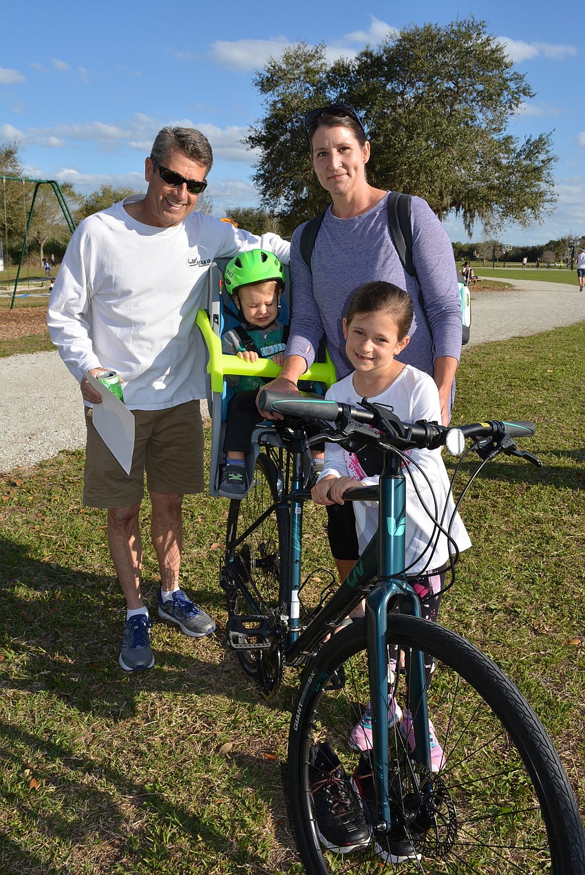 The Bower family — John, Anderson, Amy and Vivian — biked over from their home in Greenbrook so they would have a quick way to get home if they forgot something. John Bower brought the tent over earlier with his vehicle.