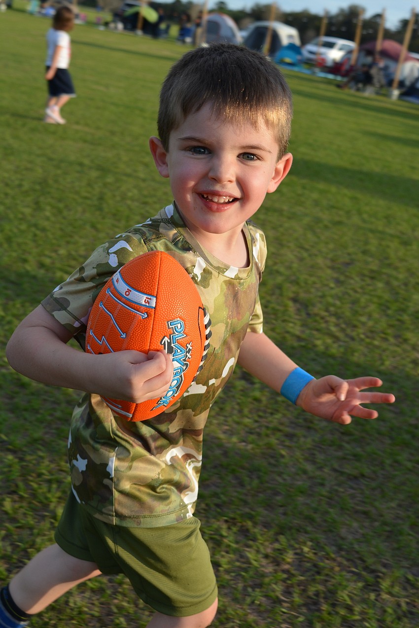 Lakewood Ranch 4-year-old Drew Mahiquez runs from his brother, Luis, and friend, Grayden Pies.