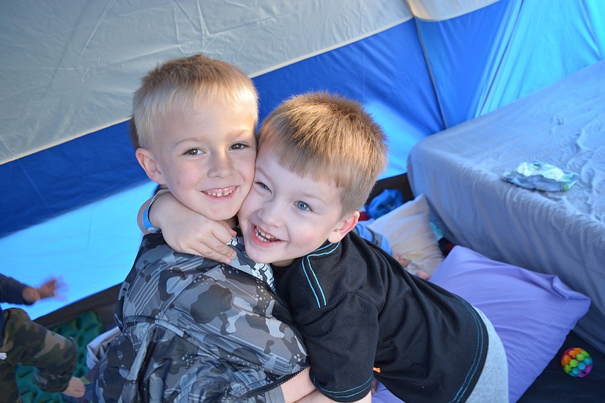 Lakewood Ranch 6-year-old Liam Skelly and his brother, 4-year-old Klaine Kvitek, had fun playing in their family's tent.