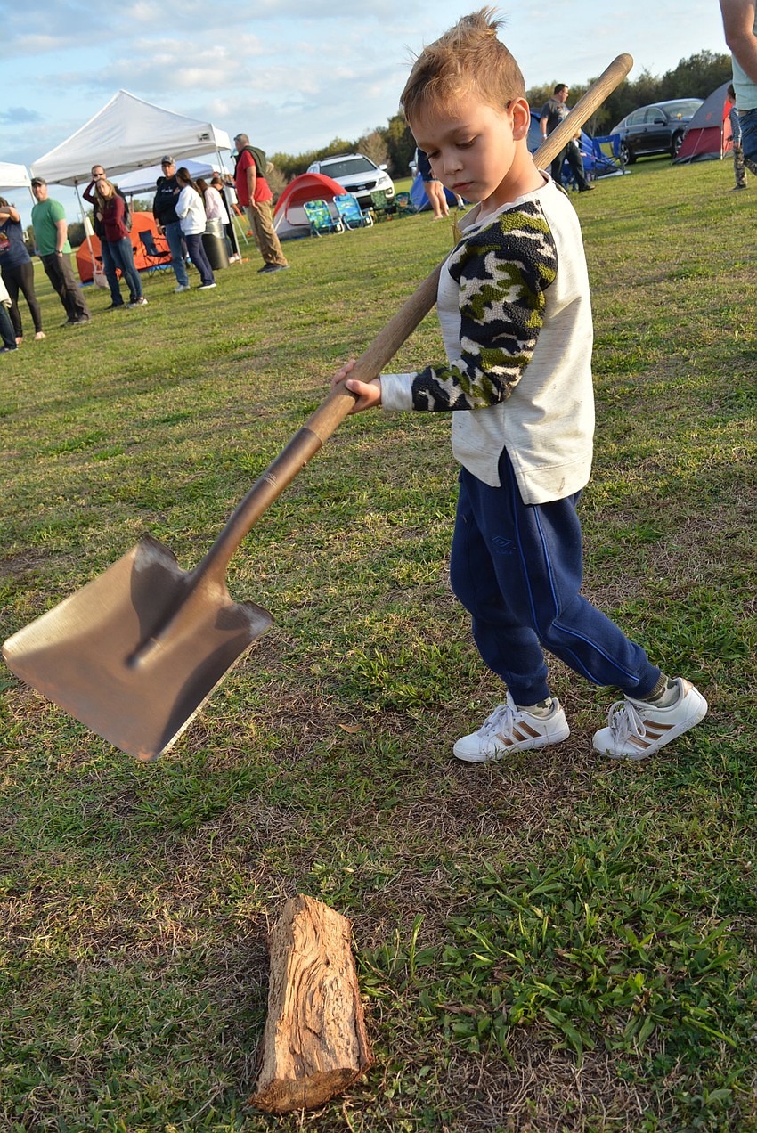 Greenbrook's Beckett Milner  liked getting to see wood added to the campfire. He camped out with his father, Kevin Milner.