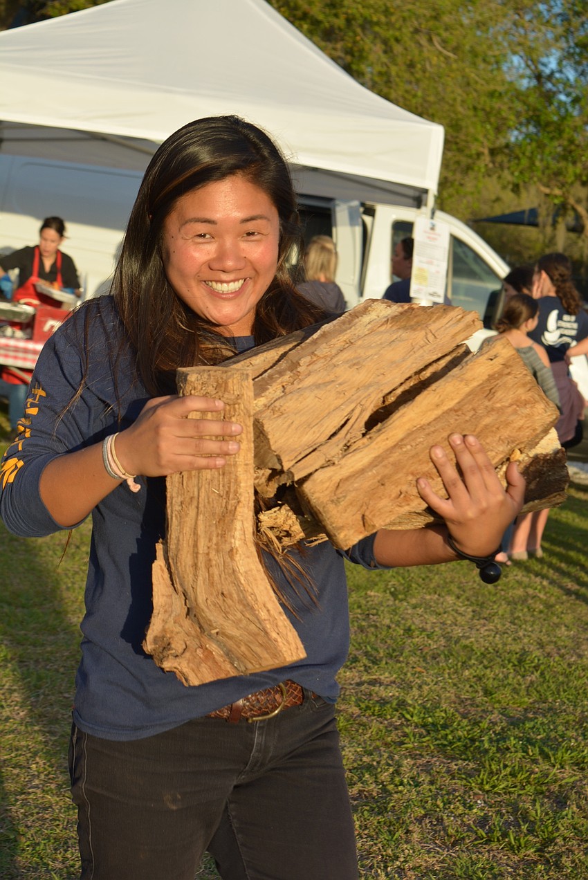 East County's Morgan Bettes, who helped organize the event, adds firewood to the campfire. Guests later were able to roast marshmallows and s'mores.