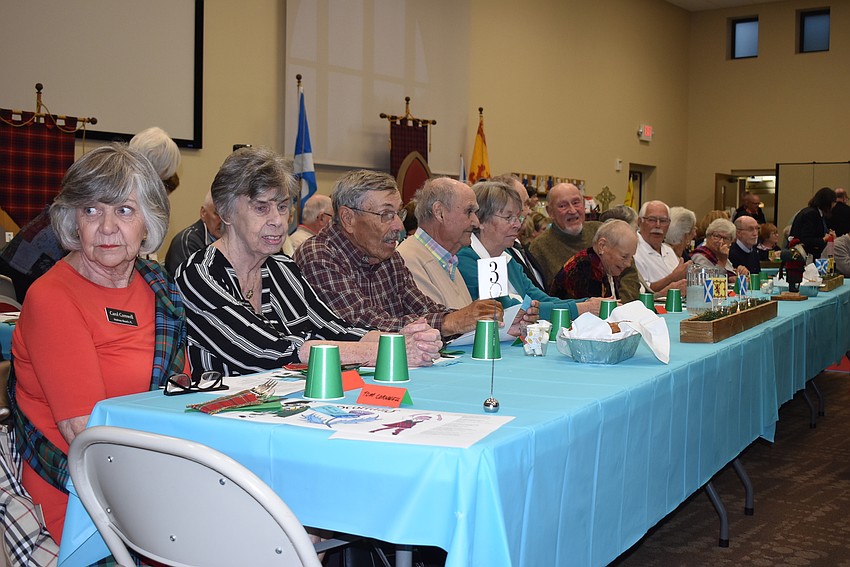 Attendees sat at long tables to be able to face the upcoming entertainment