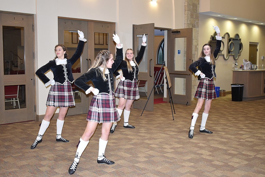 The Riverview Scottish dancers warm up before their performance.