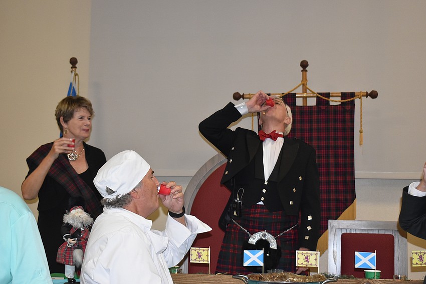 Norman Pritchard downs his whiskey.