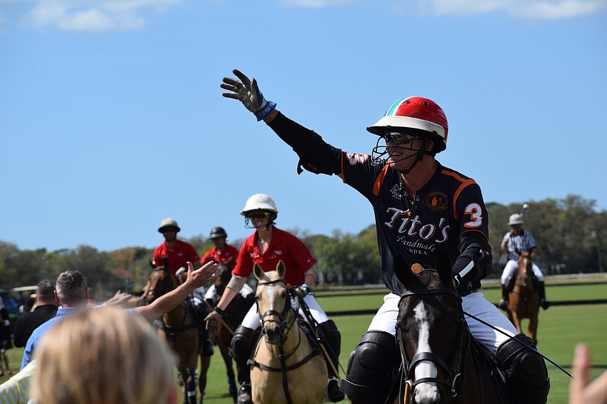 Tito's Joe Wayne Barry waves to the crowd before the start of the match.