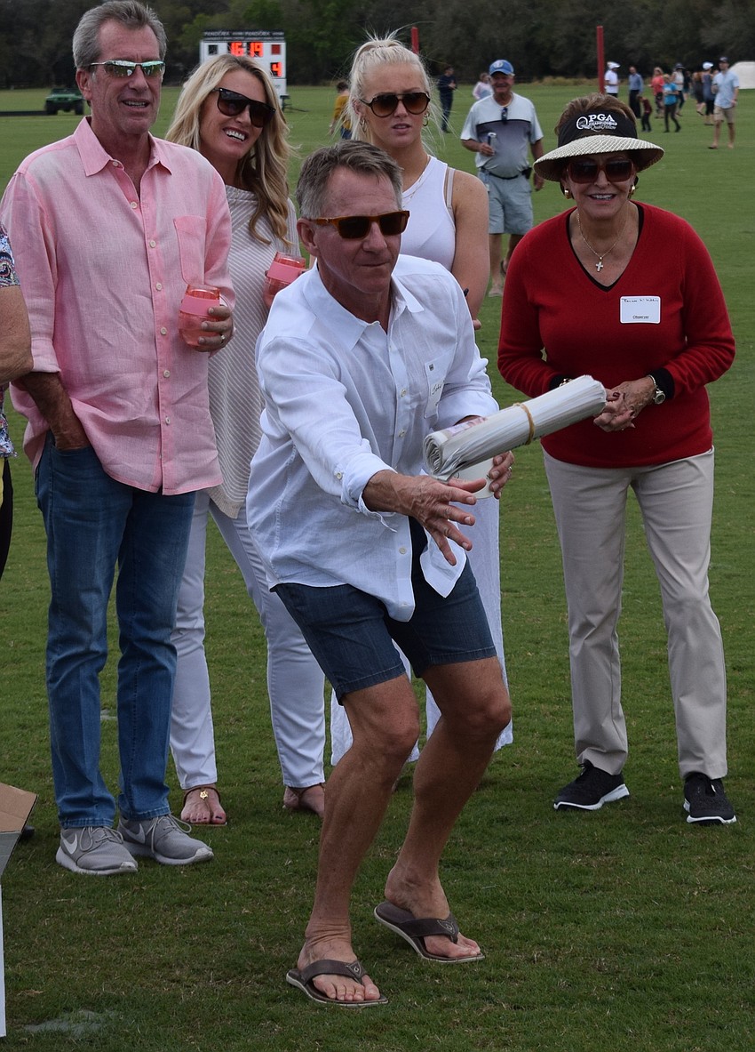 Sarasota's John Matter takes a shot at the Observer Toss. He probably never will be a paper boy.