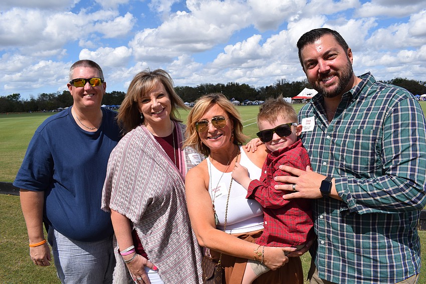 Stitch and Jennifer Horvat join Allison Imre Perkowski, 5-year-old Raymond Perkowski and Dave Perkowski at the Observer Cup.