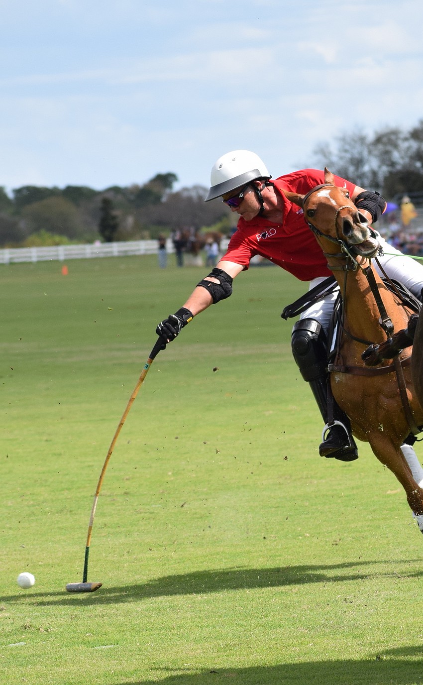 Hillcroft's James Miller is fully extended to take a shot.