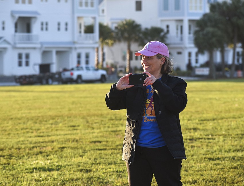 Becky Morris, assistant head of school at SMA Prep, takes photos during the race.