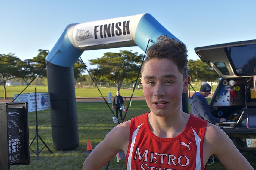 Harrison Levy, 15, was the first runner to finish the 5K.