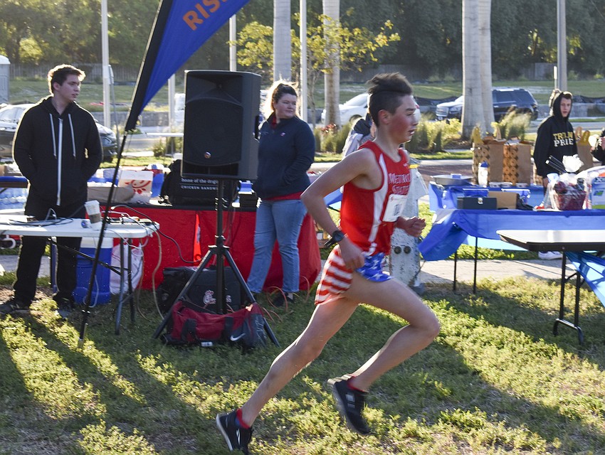 Harrison Levy, 15, runs toward the finish line.