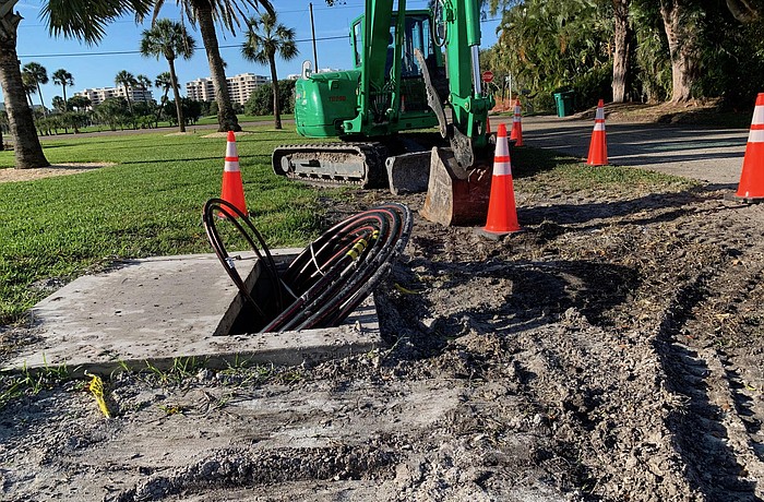 Workers have installed equipment pads and conduit on Sloop Drive in the southern end of Longboat Key.