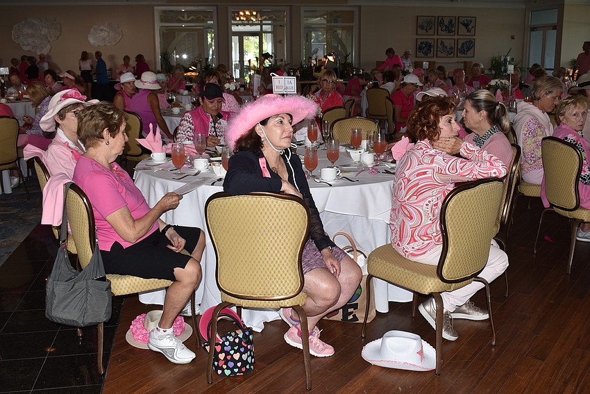 Dozens of women, all in pink, packed into Harbourside Dining Room.