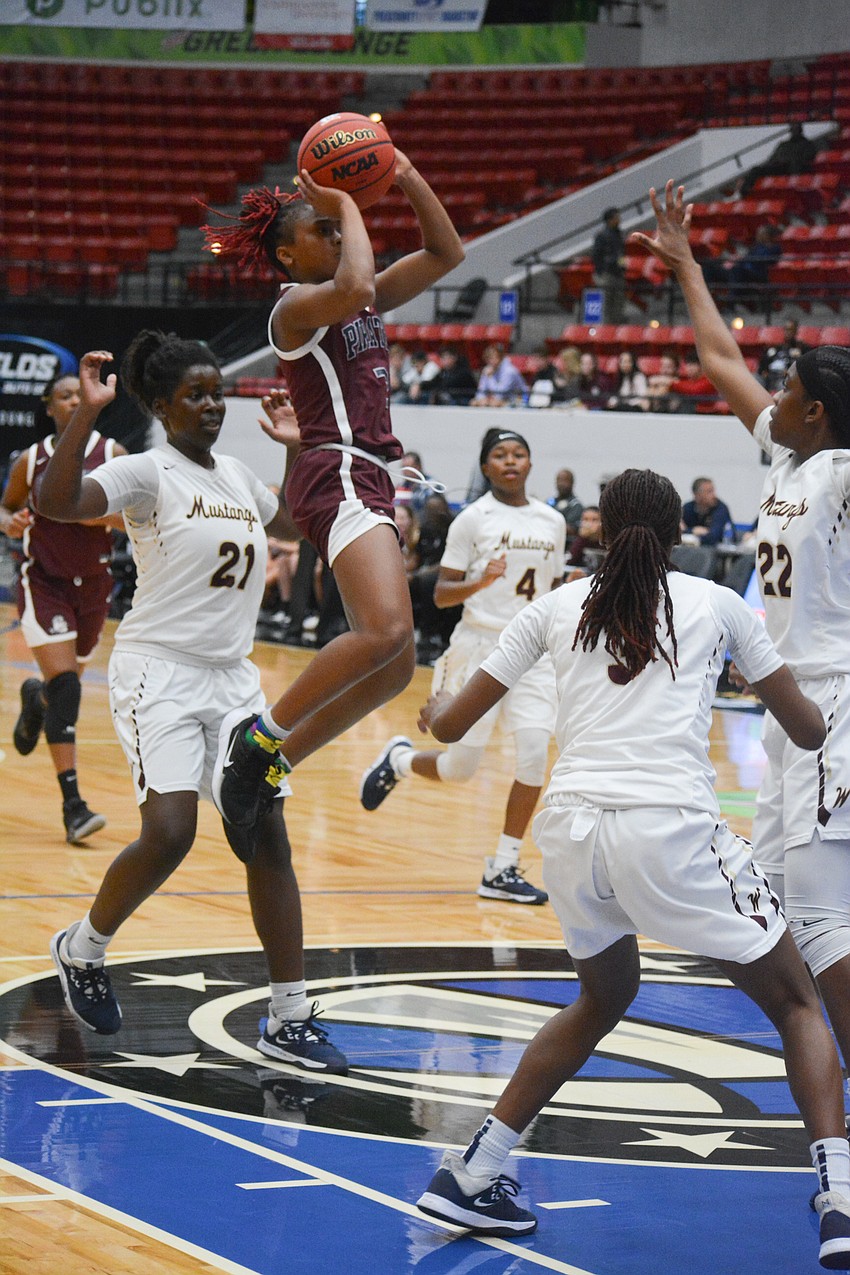 Braden River junior O'Mariah Gordon floats over the Wekiva defense for two points. Gordon finished with 27 points.