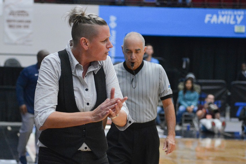 Braden River coach Stephanie Smith claps in excitement during a strong Pirates run. Braden River got within 11 points of Wekiva in the fourth quarter.