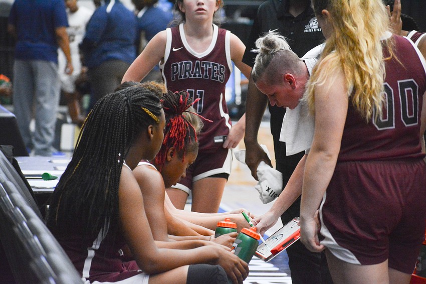 Braden River coach Stephanie Smith challenges her team during a timeout in the fourth quarter.